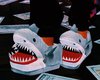 peach shark slippers.